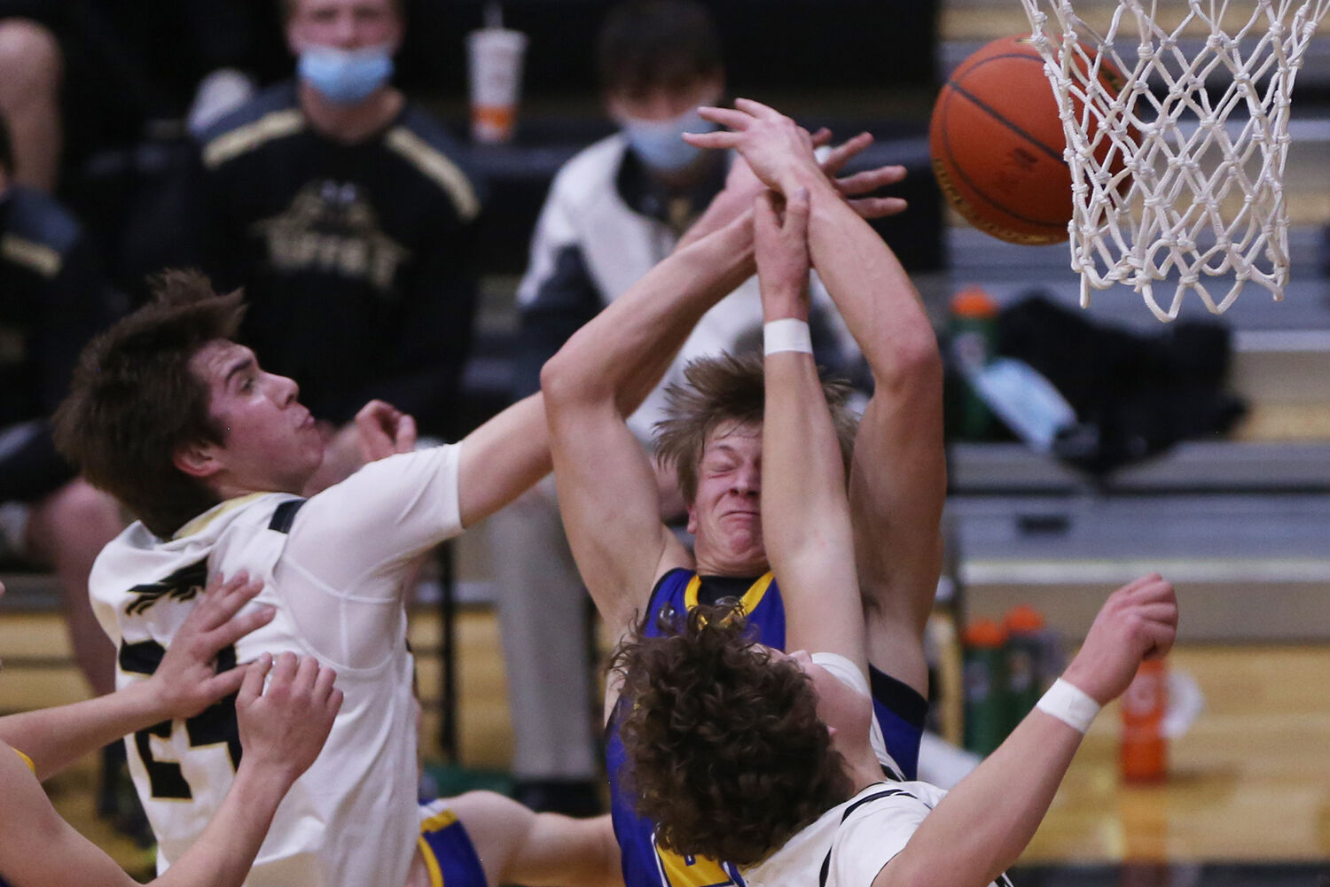 Adam Suko winces as he takes an elbow to the face from Buffalo senior Calvin Rule